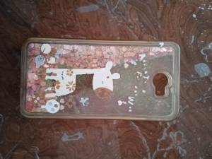 Funda rosa con adornitos para movil